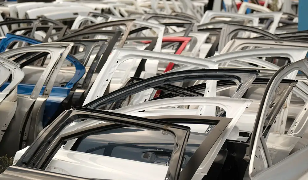 Car doors in an auto dismantling yard covered by specialized business insurance in Charlotte, NC